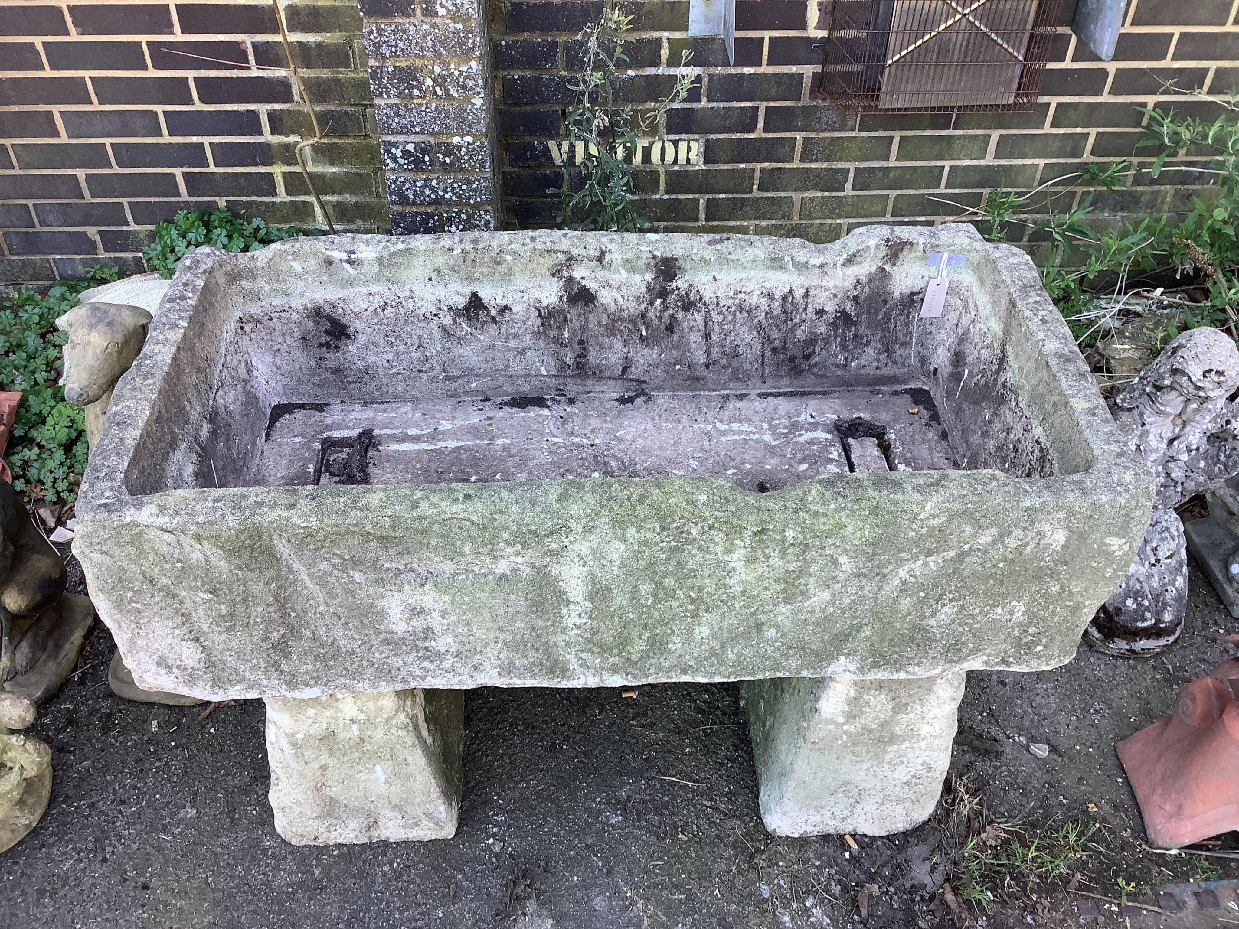 A stone trough, width 122cm, depth 60cm, height 84cm. Condition - fair